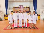 พิธีทำบุญตักบาตรและจุดเทียนถวายพระพรชัยมงคล